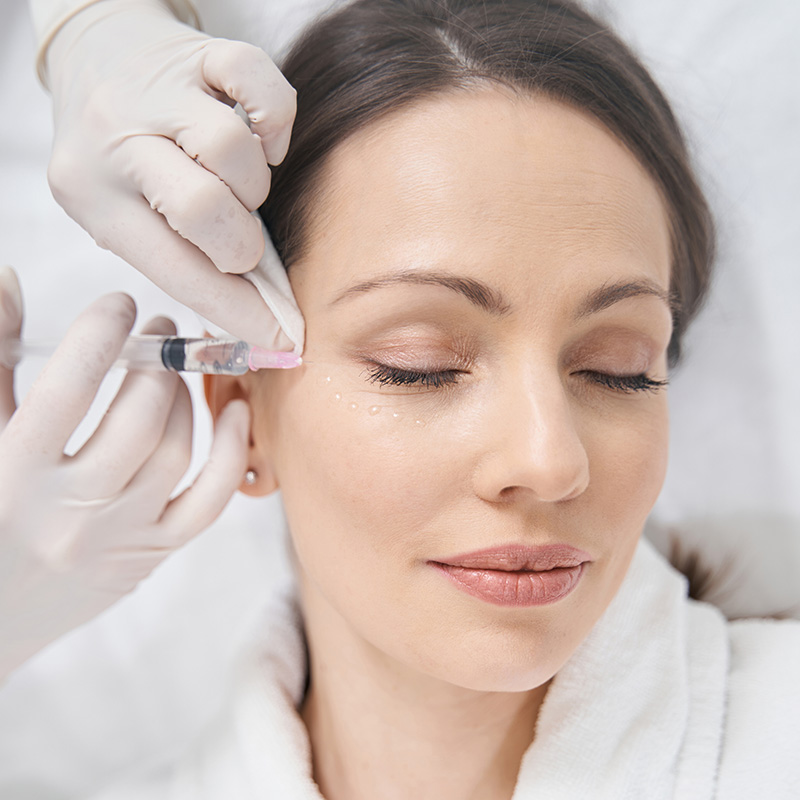 Woman receiving peptide therapy